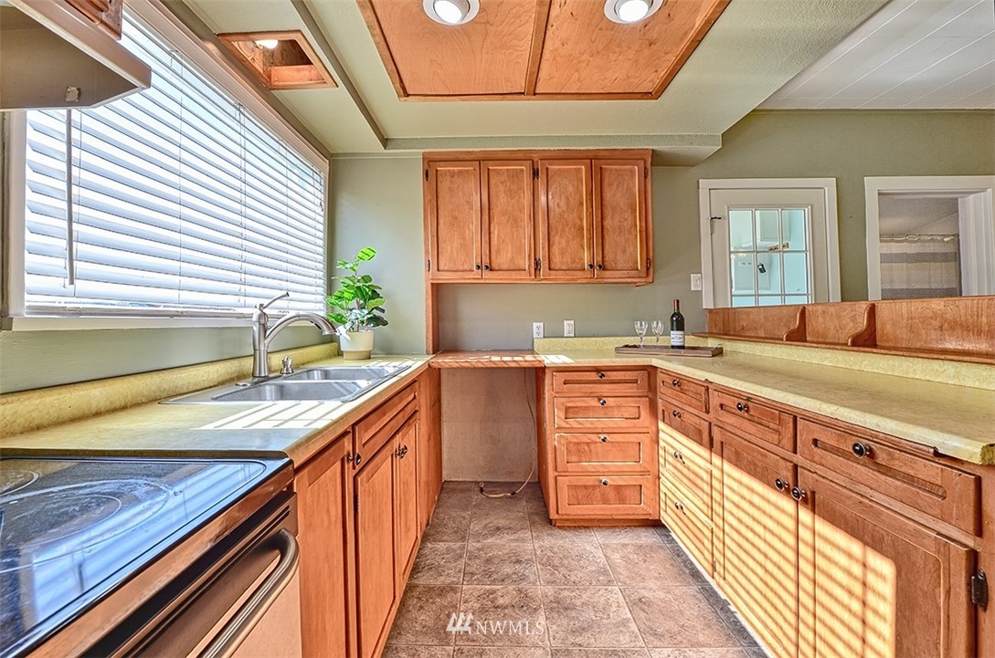 8263 Nooksack Road Everson, WA 98247 - Photo 8 of 36 a kitchen with stainless steel appliances granite countertop a sink and a stove