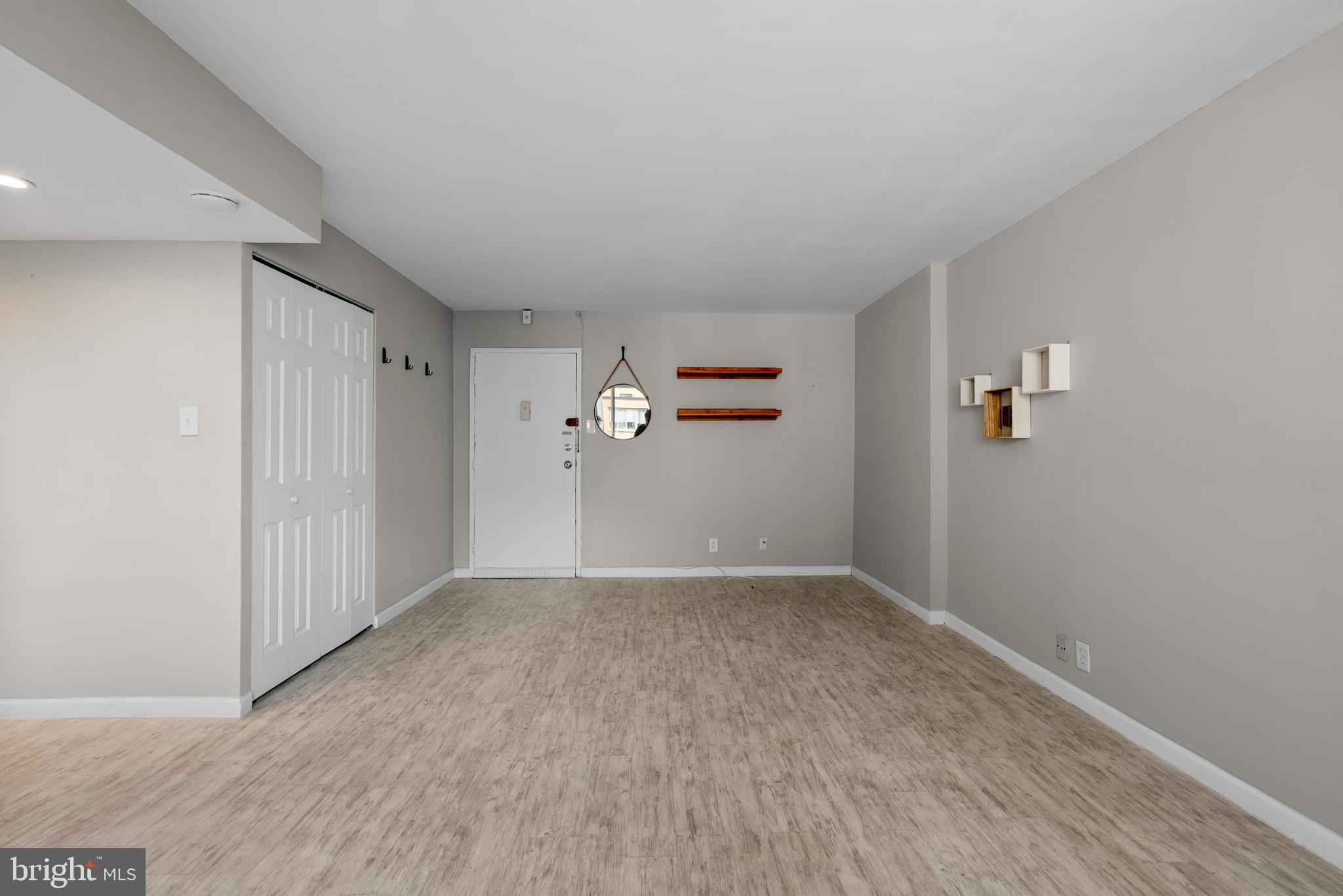 1420 N Street Northwest, Unit 914 Washington, DC 20005 - Photo 4 of 23 wooden floor in an empty room