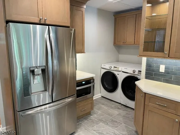 a view of a kitchen with washer and dryer