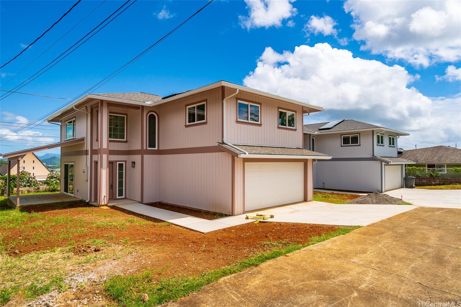 45-677 Halekou Road, Unit E Kaneohe, HI 96744 - Photo 1 of 1 a front view of a house with a yard