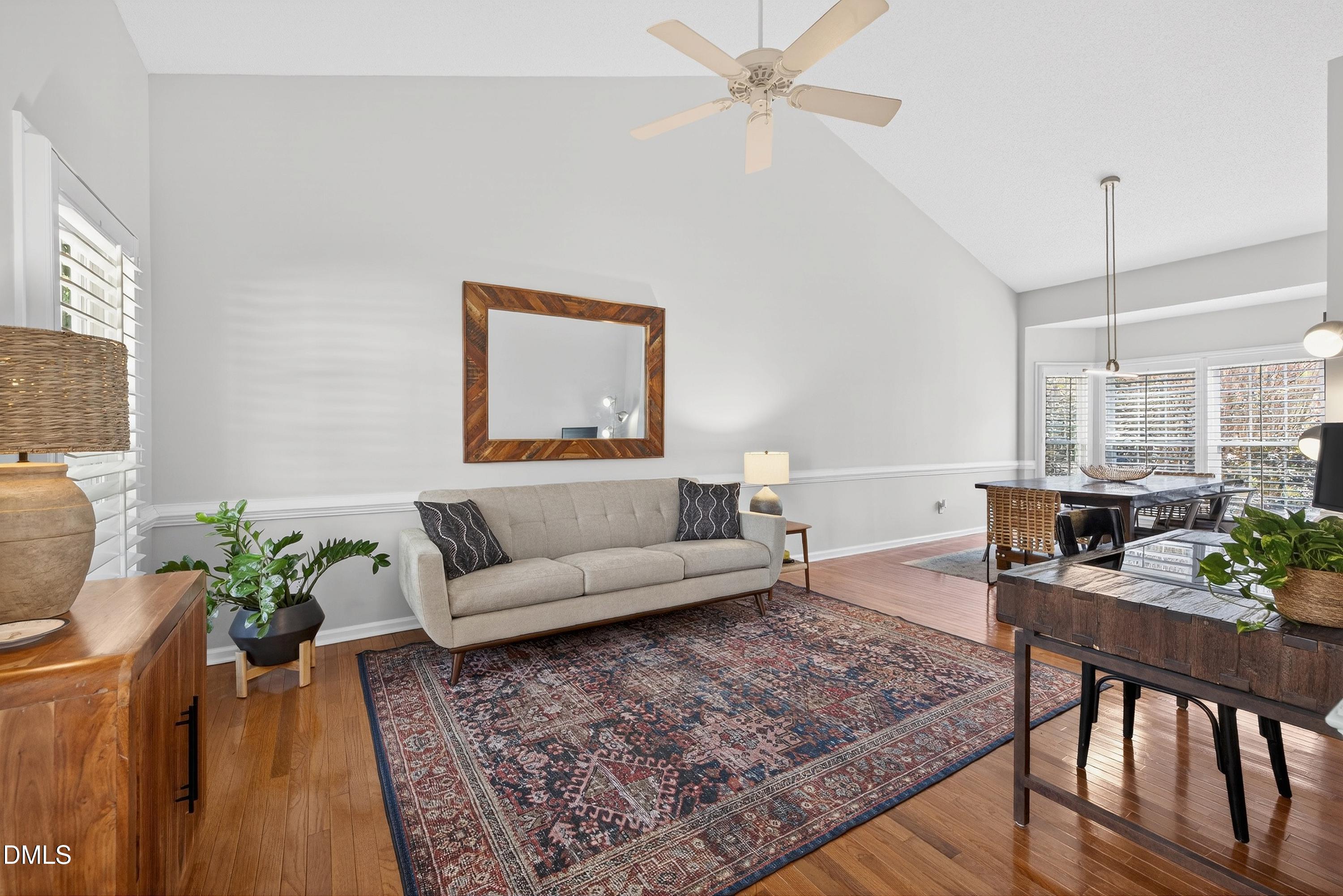 9432 Cartersville Court Raleigh, NC 27617 - Photo 20 of 66 a living room with furniture and wooden floor