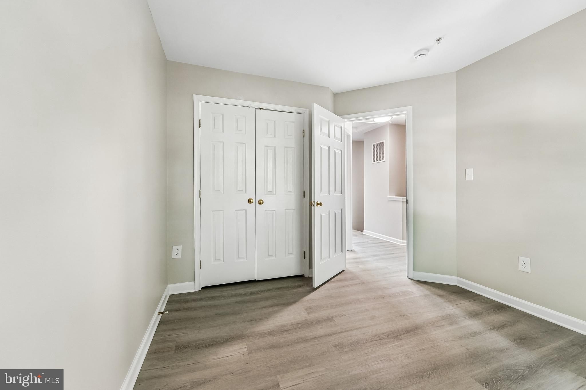 1461 Pangbourne Way Hanover, MD 21076 - Photo 29 of 51 a view of a hallway with wooden floor