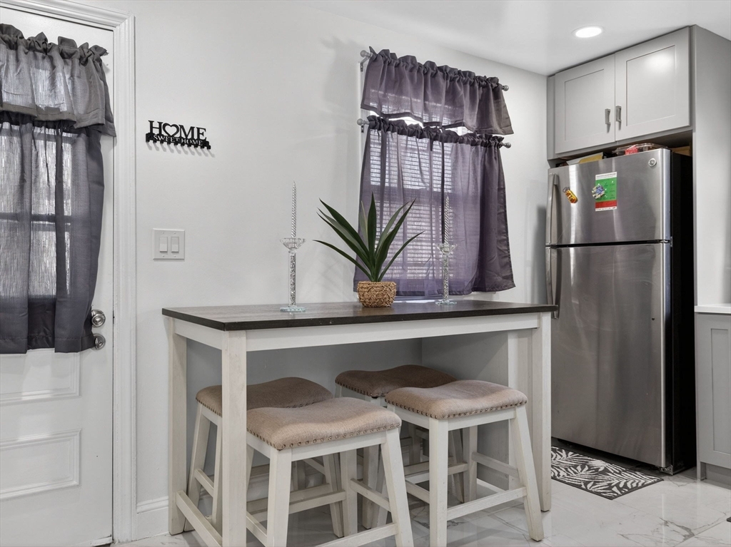19 Melba Way Boston, MA 02136 - Photo 12 of 34 a view of kitchen with refrigerator and wooden floor