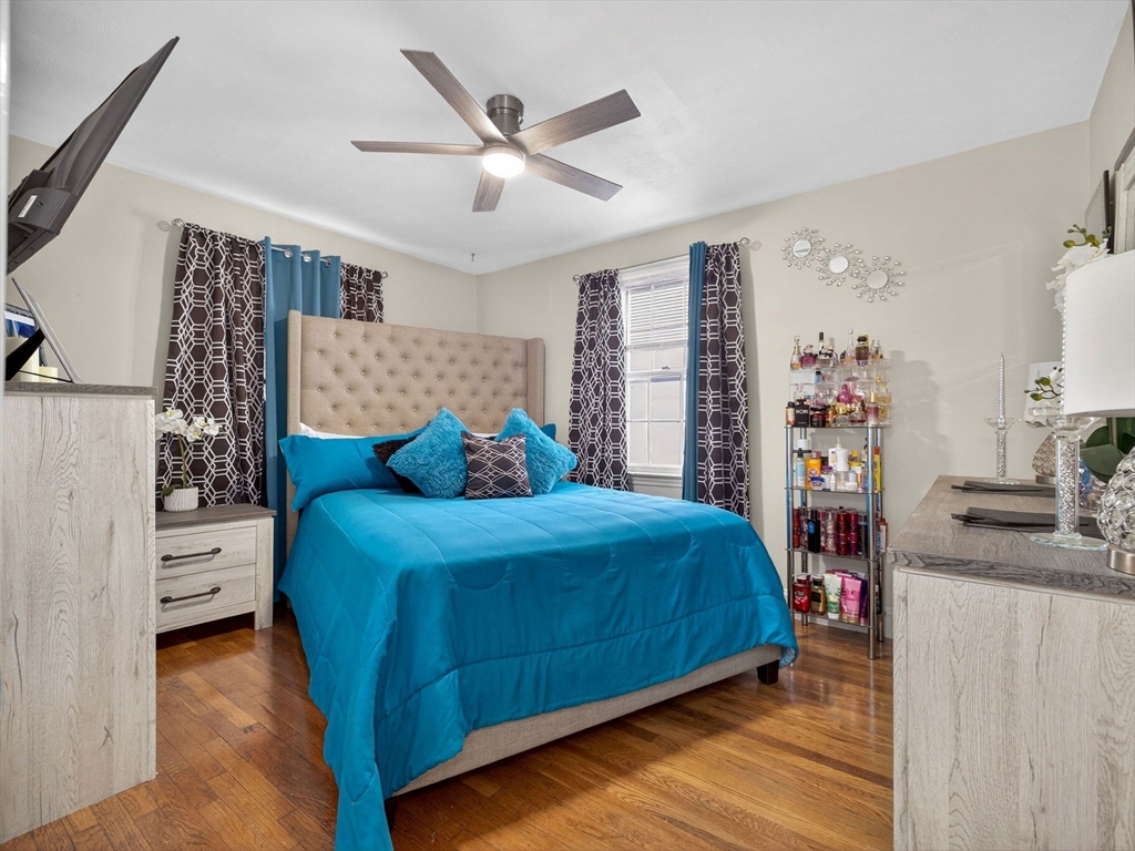 19 Melba Way Boston, MA 02136 - Photo 13 of 34 a bedroom with a bed and a cabinets