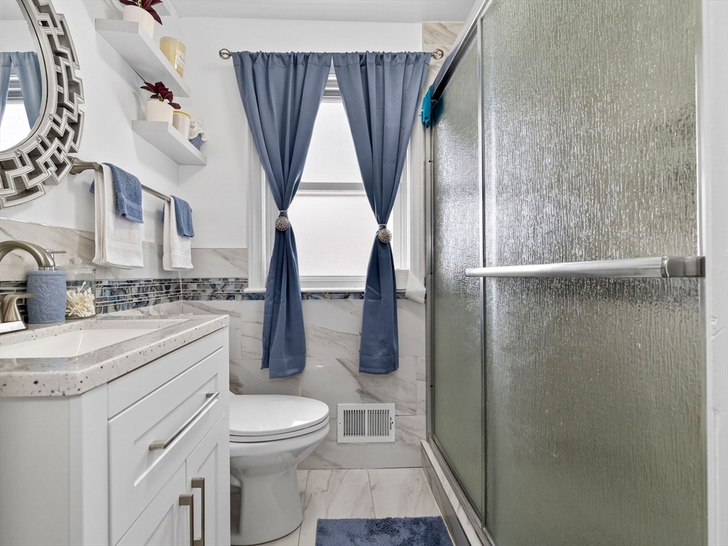 19 Melba Way Boston, MA 02136 - Photo 14 of 34 a bathroom with a granite countertop sink toilet and shower