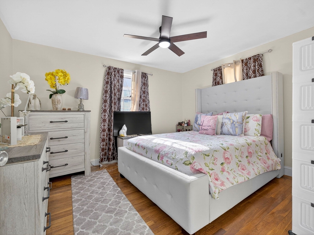 19 Melba Way Boston, MA 02136 - Photo 16 of 34 a bedroom with a bed and cabinet