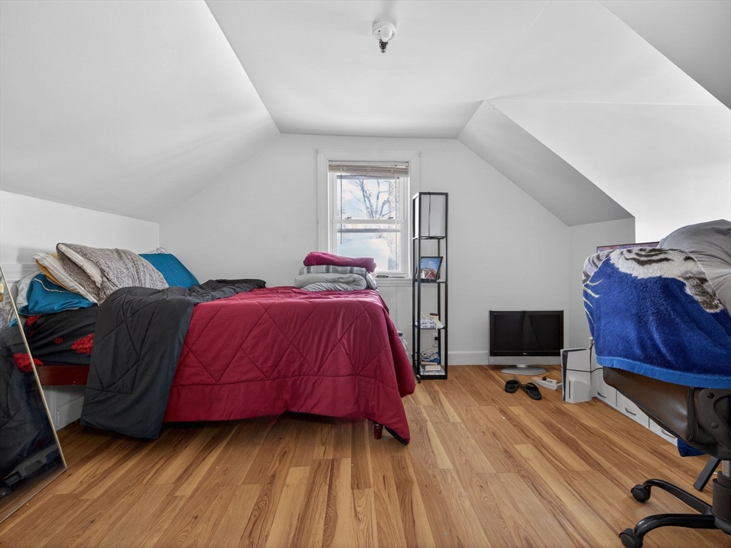 19 Melba Way Boston, MA 02136 - Photo 17 of 34 a bed room with a bed and a chair