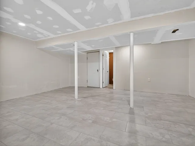 a white toilet sitting next to a bathroom sink