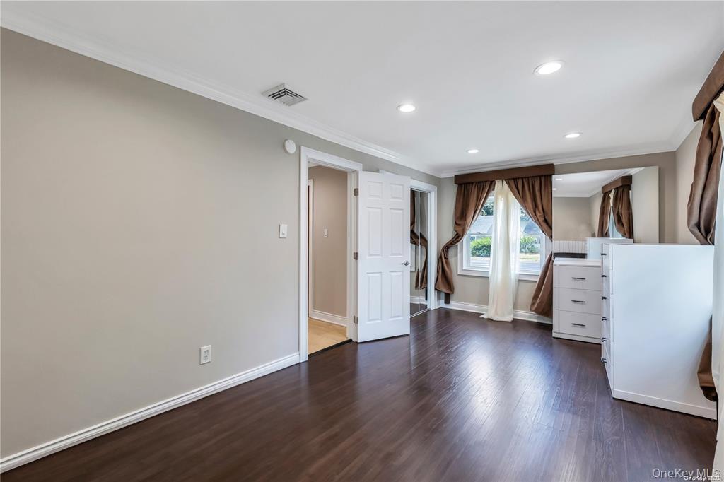 531 Old Country Road Plainview, NY 11803 - Photo 15 of 28 a view of a livingroom with furniture and wooden floor