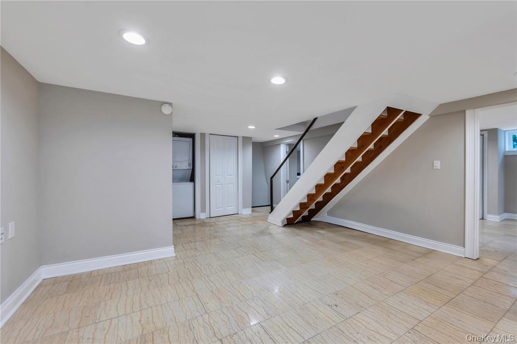 531 Old Country Road Plainview, NY 11803 - Photo 22 of 28 a view of an empty room with stairs