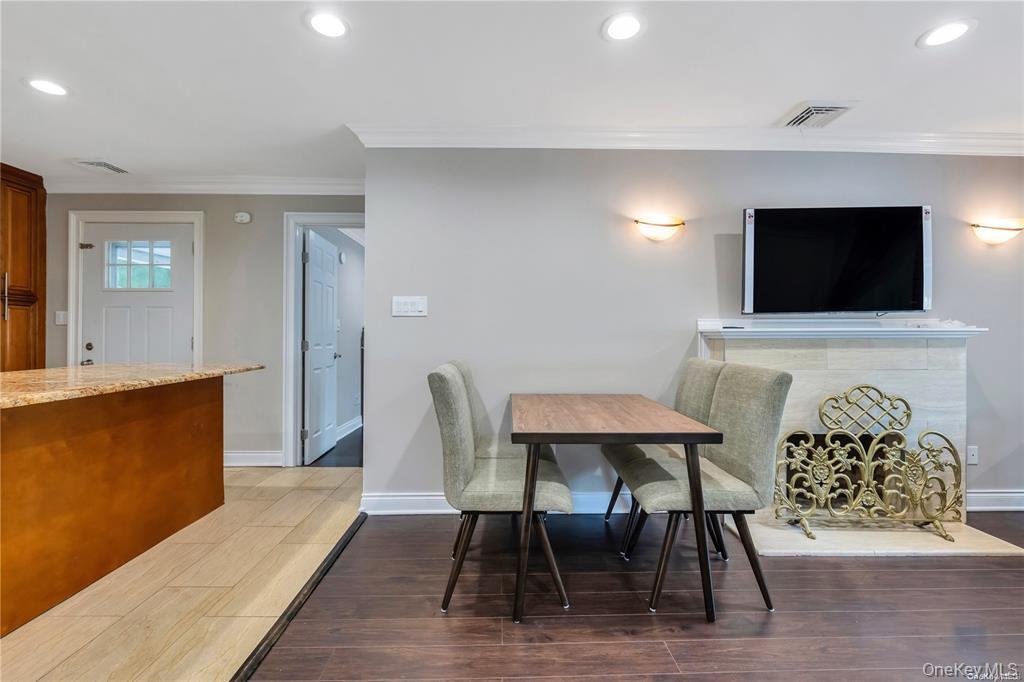 531 Old Country Road Plainview, NY 11803 - Photo 8 of 28 a view of a livingroom with furniture and a flat screen tv
