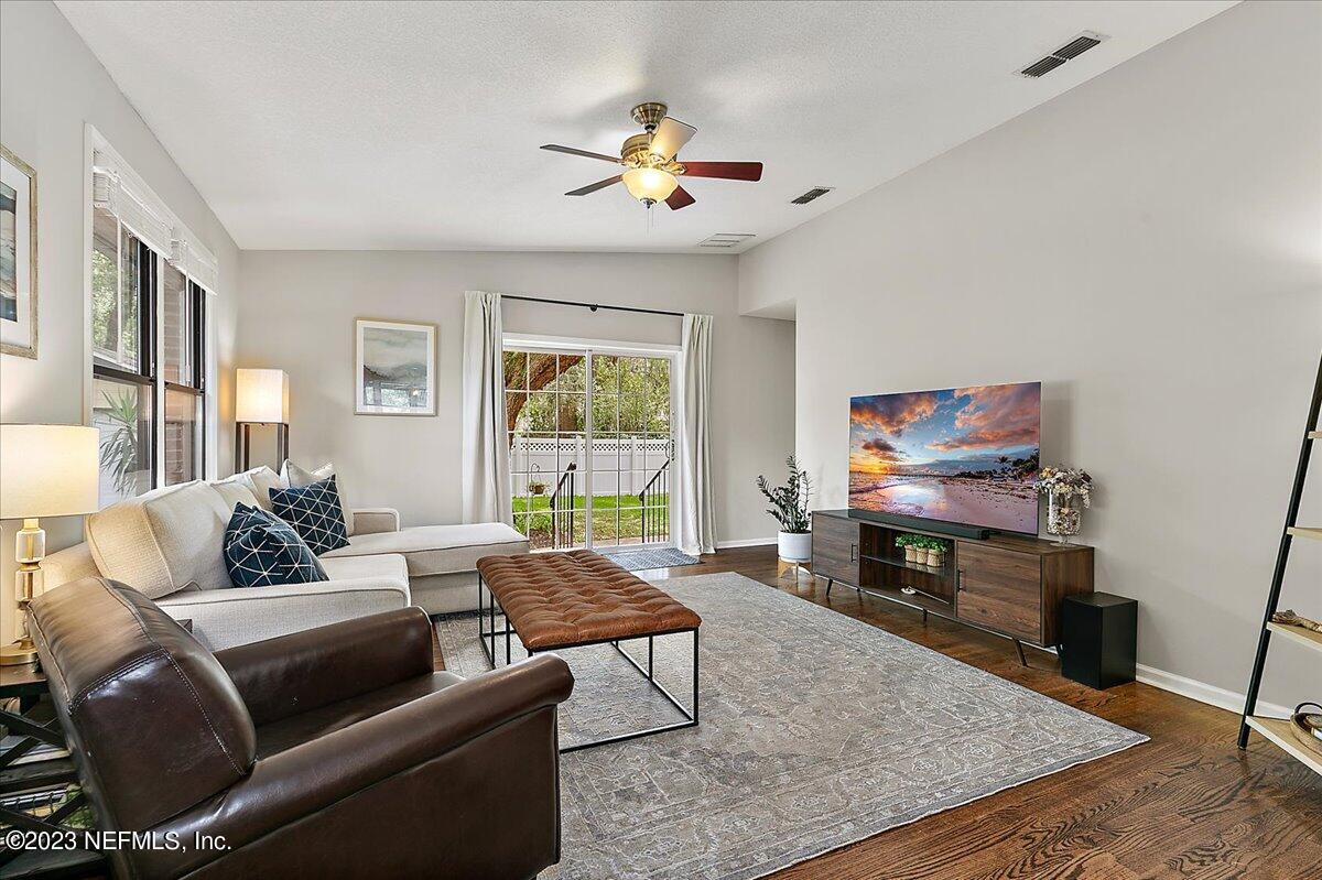 1445 Nicholson Road Jacksonville, FL 32207 - Photo 13 of 31 a living room with furniture and a flat screen tv