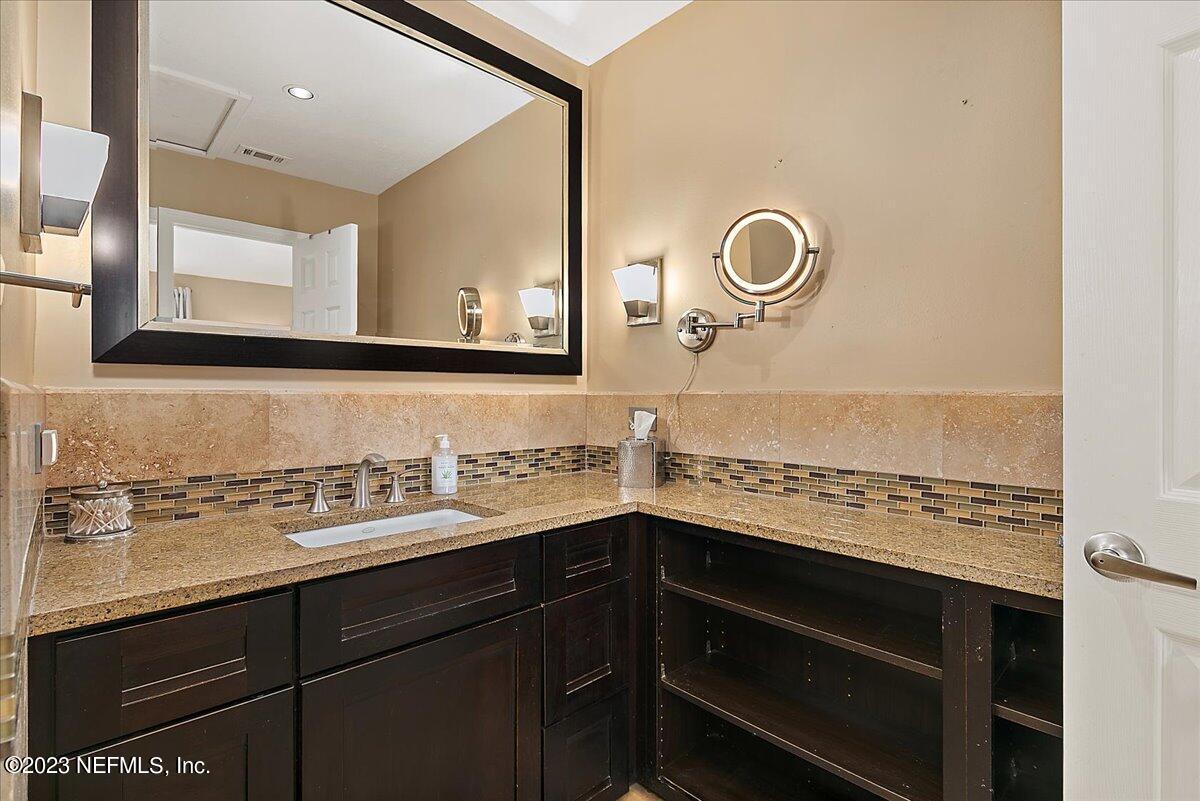 1445 Nicholson Road Jacksonville, FL 32207 - Photo 17 of 31 a view of cabinets and wooden floor