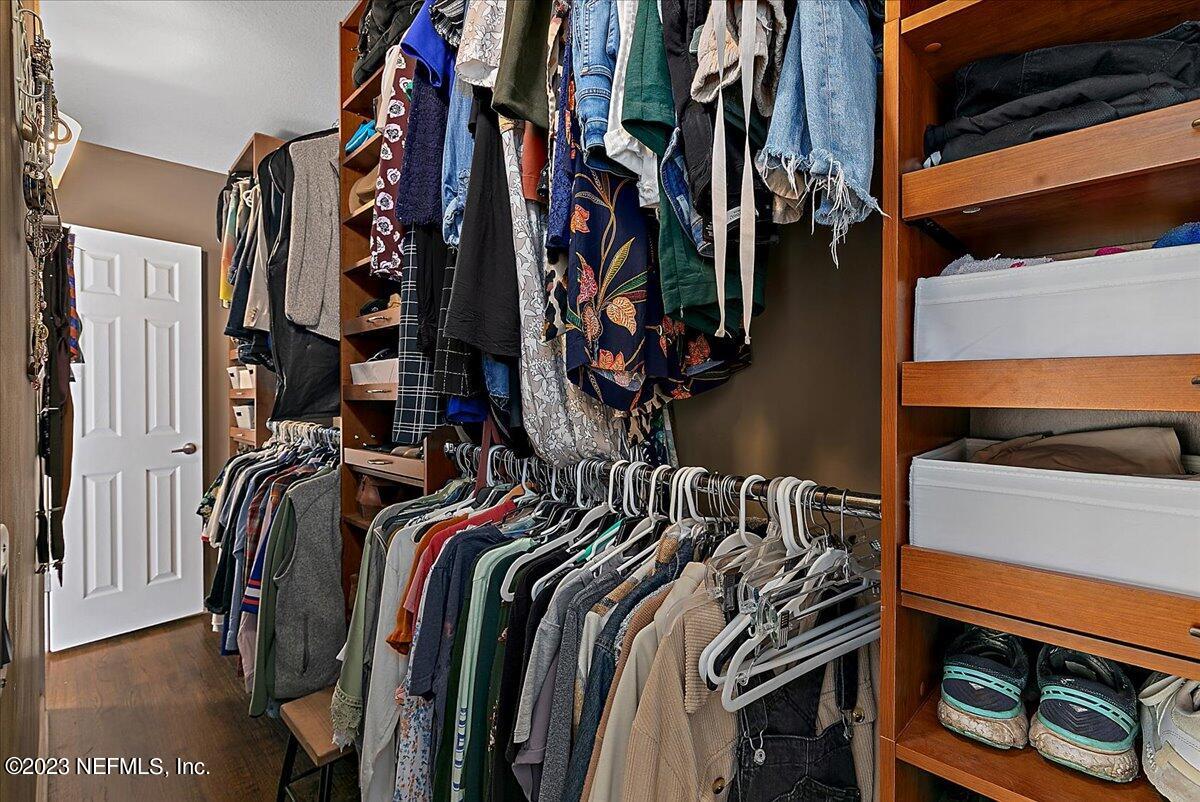 1445 Nicholson Road Jacksonville, FL 32207 - Photo 19 of 31 a view of walk in closet with clothes and shoes