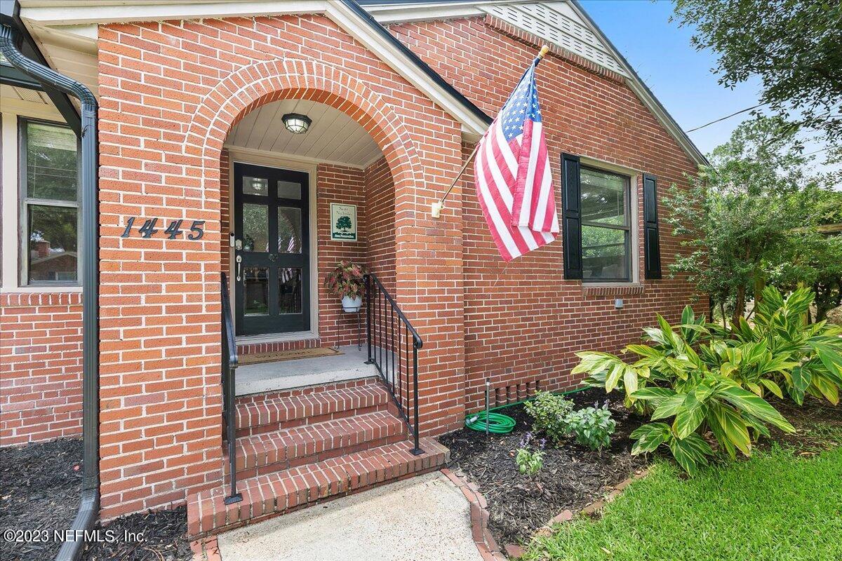 1445 Nicholson Road Jacksonville, FL 32207 - Photo 3 of 31 a front view of a house with a garden