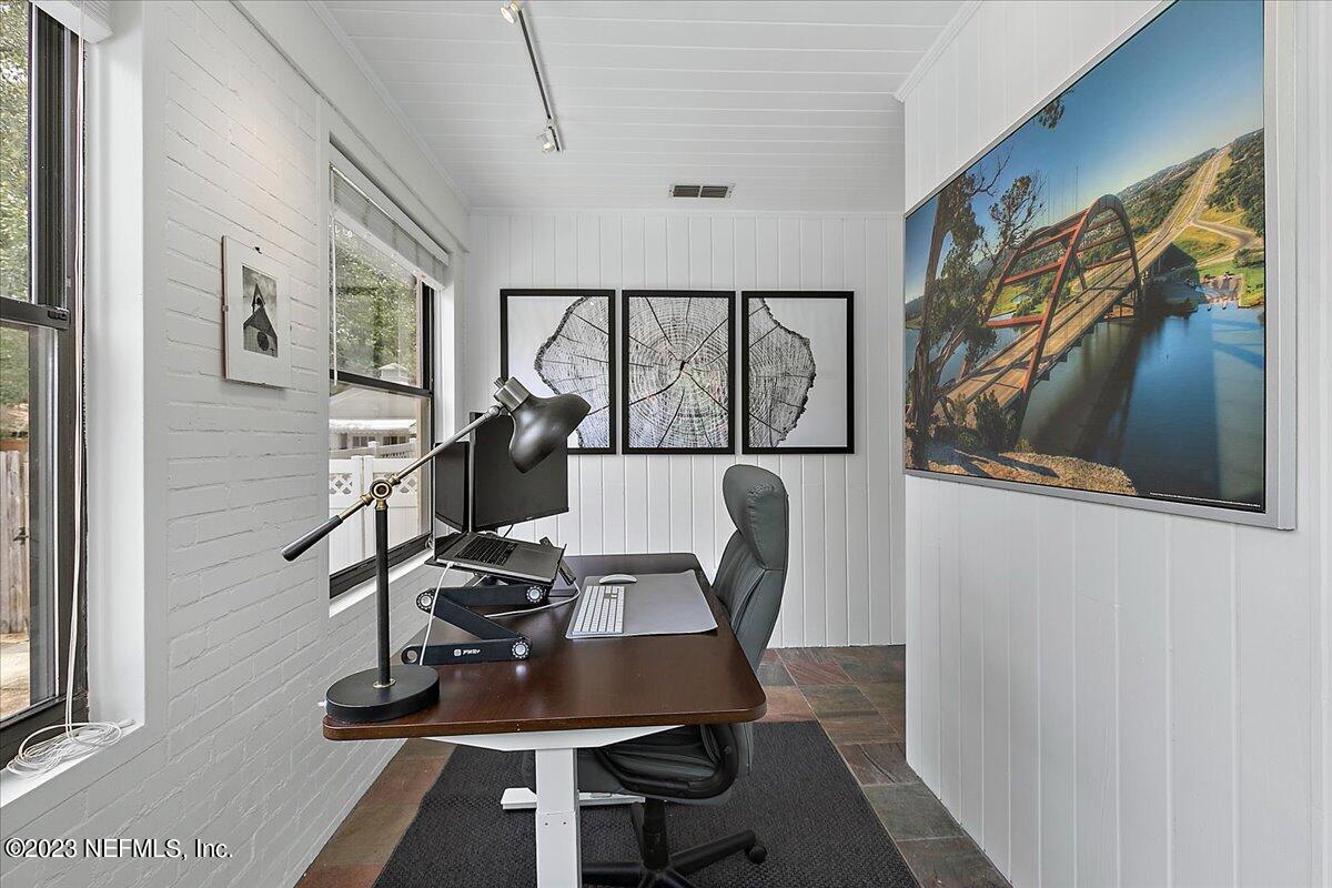 1445 Nicholson Road Jacksonville, FL 32207 - Photo 8 of 31 a view of a workspace with furniture and a window