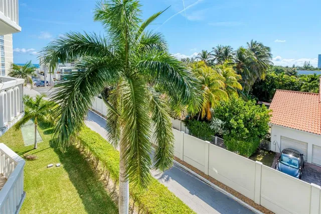 a view of a yard and swimming pool