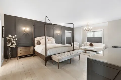 a bed room with a bed window and a table