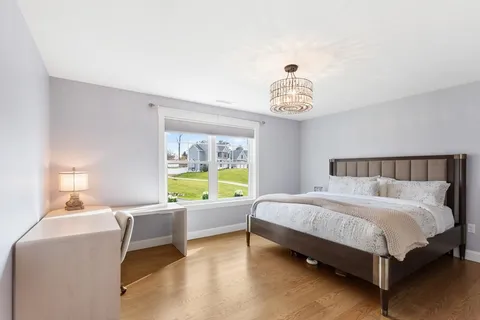 a bed room with a bed and a window
