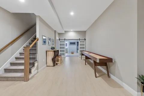 a view of entryway wih livingroom and stairs