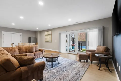 a living room with furniture and a rug