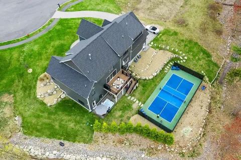an aerial view of a house with outdoor space