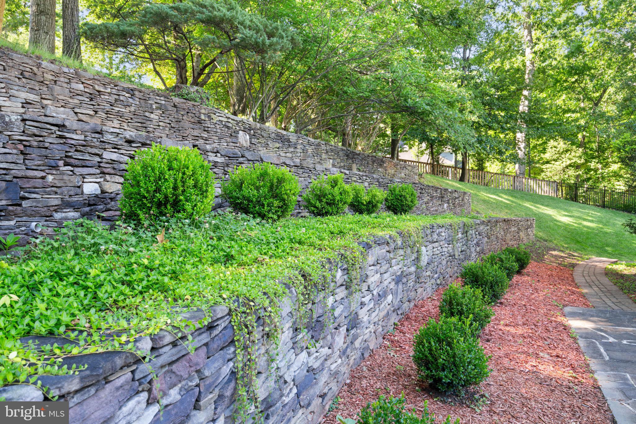 9713 Rhapsody Drive Vienna, VA 22181 - Photo 24 of 28 Three Tiered Retaining Wall