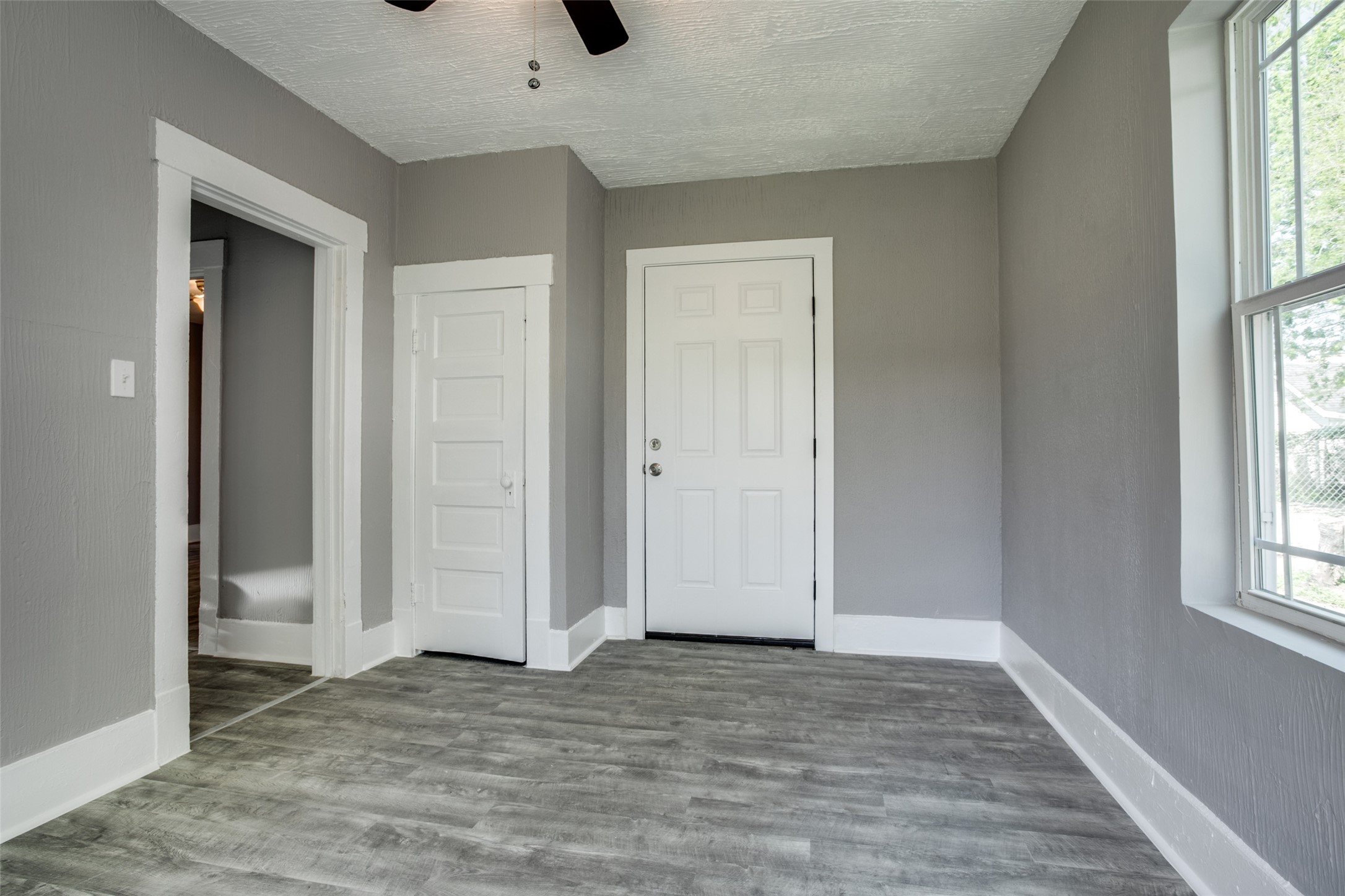 810 Maltby Street, Unit 2 Houston, TX 77011 - Photo 1 of 24 an empty room with window and hardwood floor