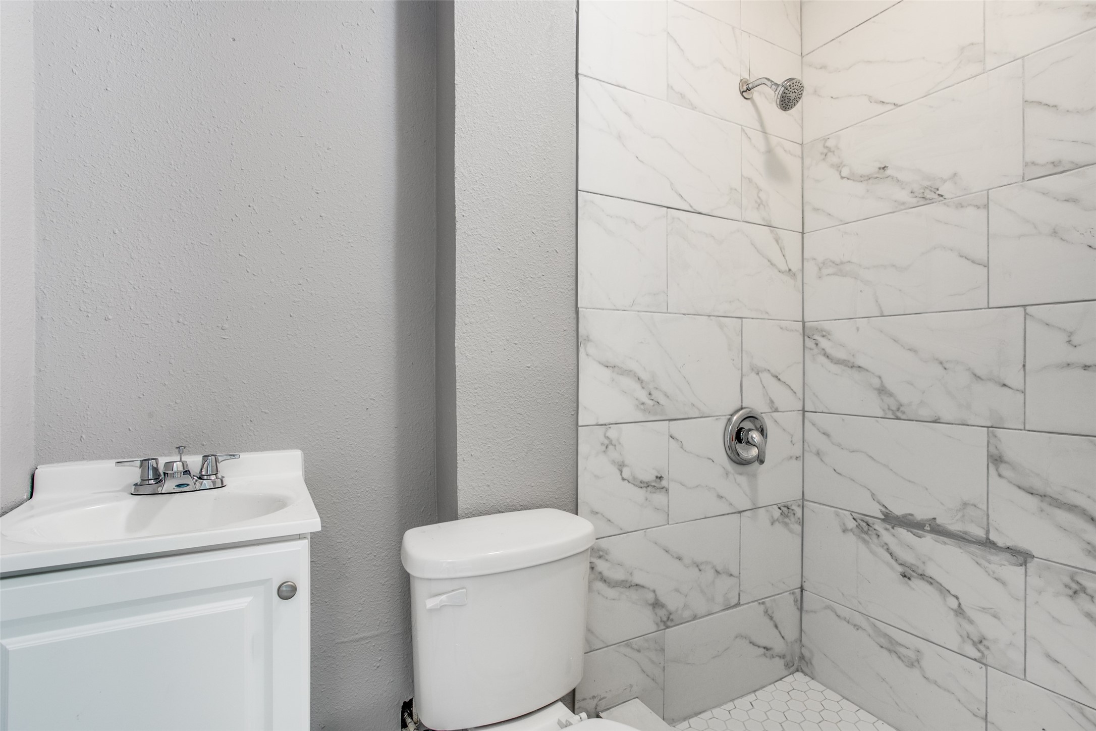 810 Maltby Street, Unit 2 Houston, TX 77011 - Photo 12 of 24 a bathroom with a toilet and a sink