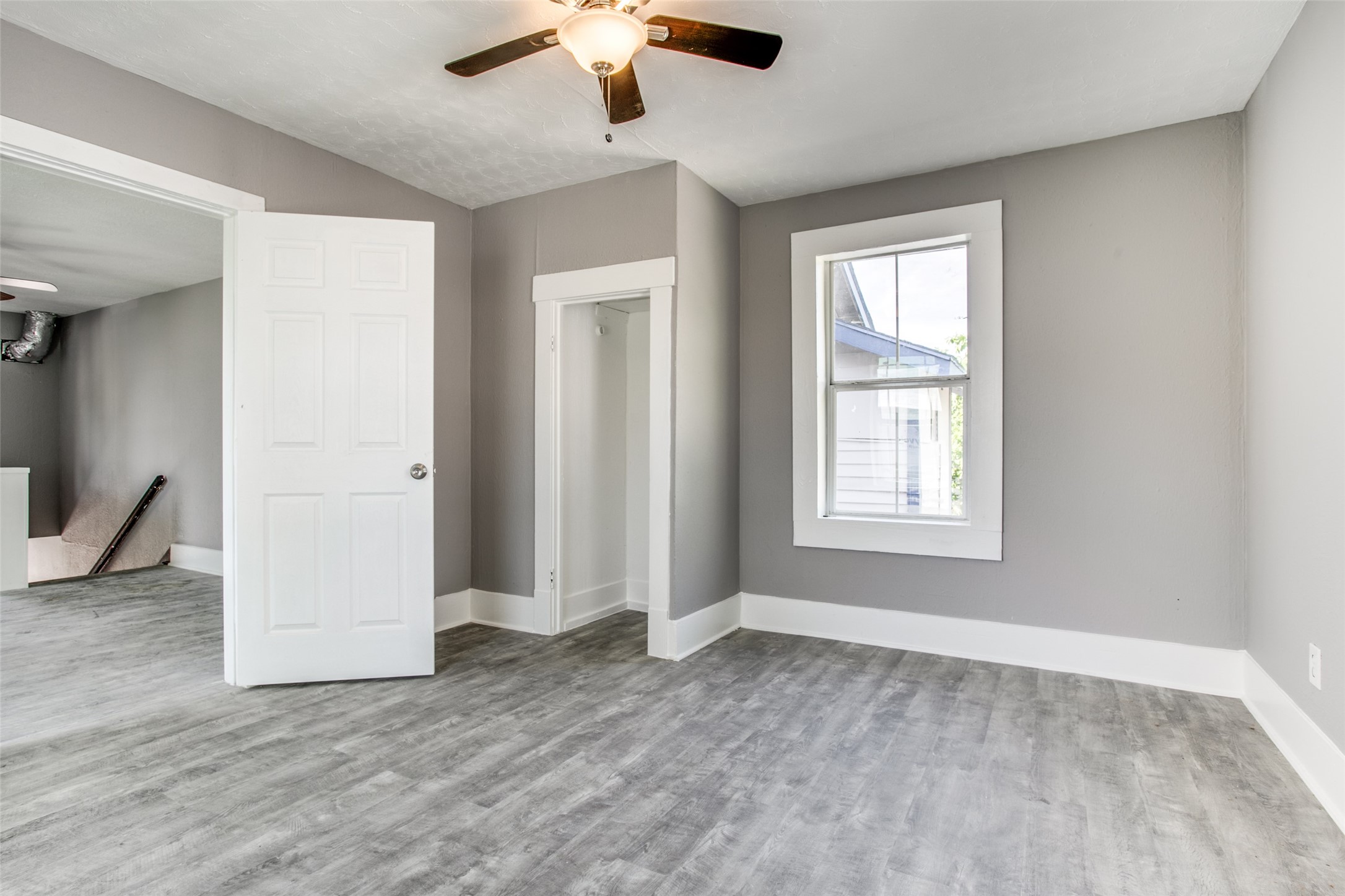 810 Maltby Street, Unit 2 Houston, TX 77011 - Photo 14 of 24 wooden floor in an empty room with a window