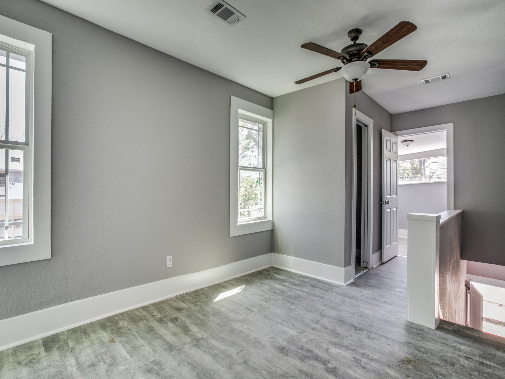 810 Maltby Street, Unit 2 Houston, TX 77011 - Photo 16 of 24 a view of a livingroom with a window and wooden floor