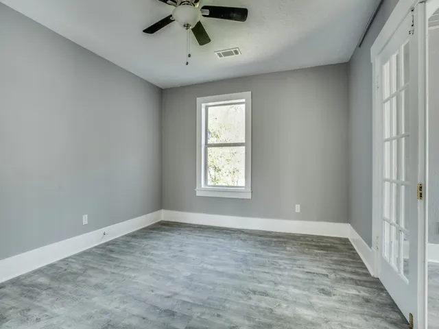 a view of empty room with windows