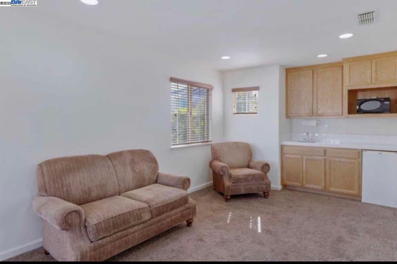 557 Stetson Drive Oakdale, CA 95361 - Photo 5 of 8 a living room with furniture and a window