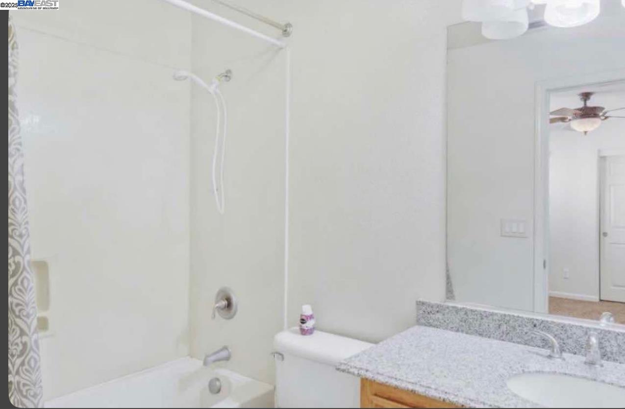 557 Stetson Drive Oakdale, CA 95361 - Photo 8 of 8 a bathroom with a sink and a mirror