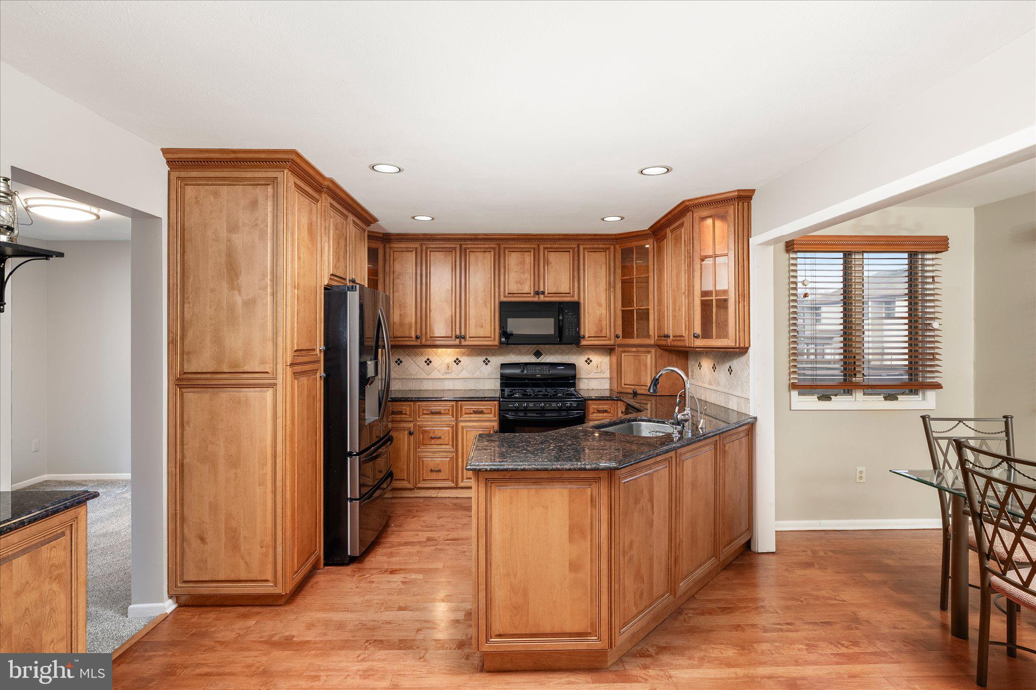766 Twin Rivers Drive North East Windsor, NJ 08520 - Photo 12 of 31 a kitchen with stainless steel appliances granite countertop a refrigerator and a stove top oven