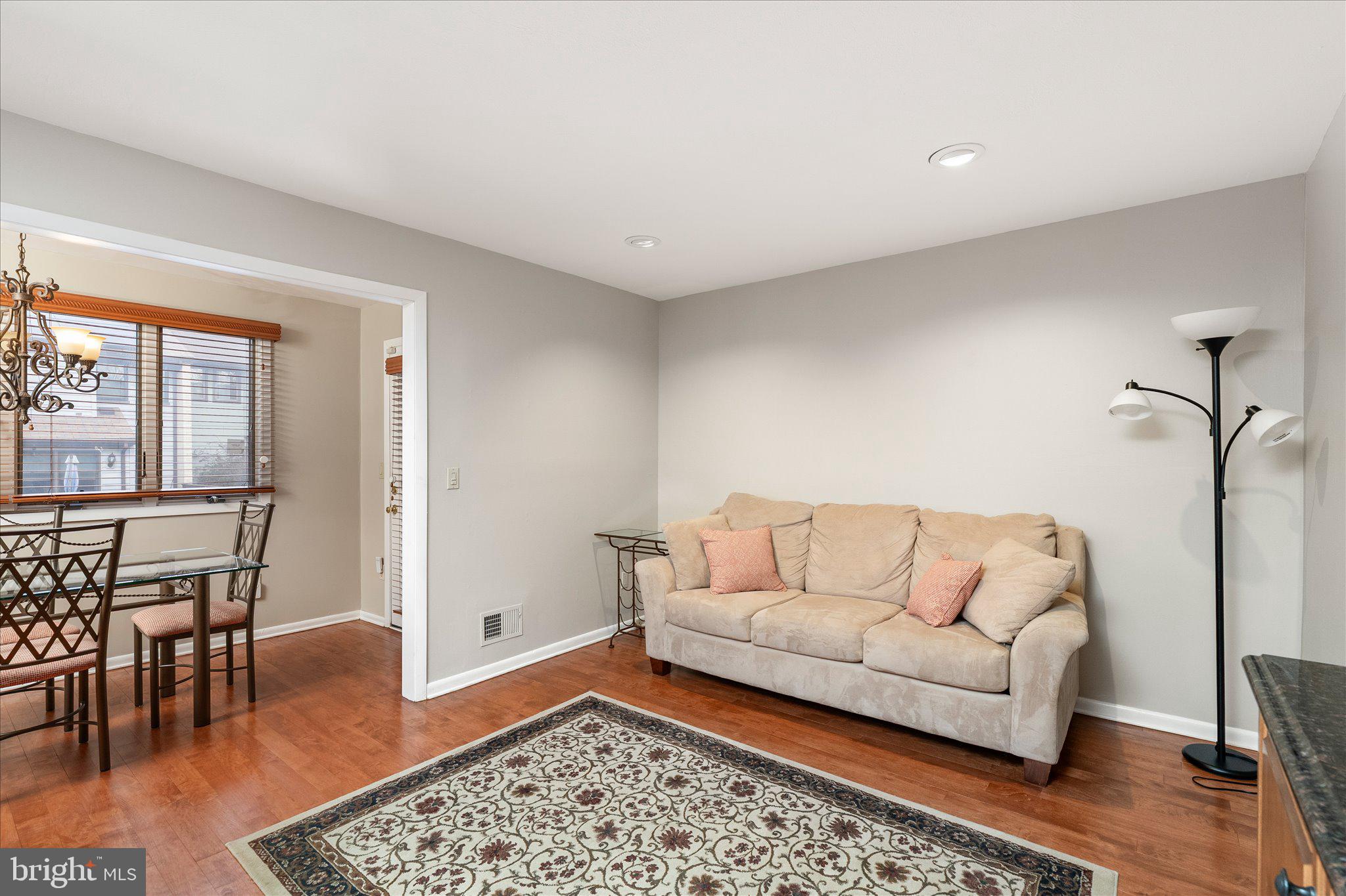 766 Twin Rivers Drive North East Windsor, NJ 08520 - Photo 15 of 31 a living room with furniture and a rug