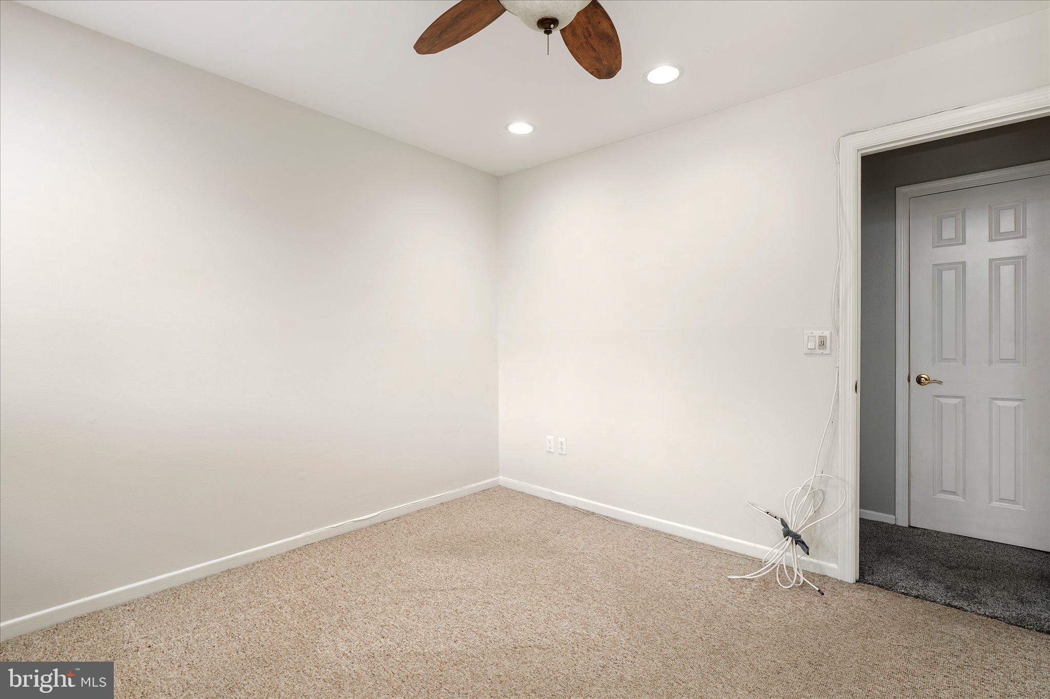 766 Twin Rivers Drive North East Windsor, NJ 08520 - Photo 19 of 31 an empty room with a ceiling fan and window