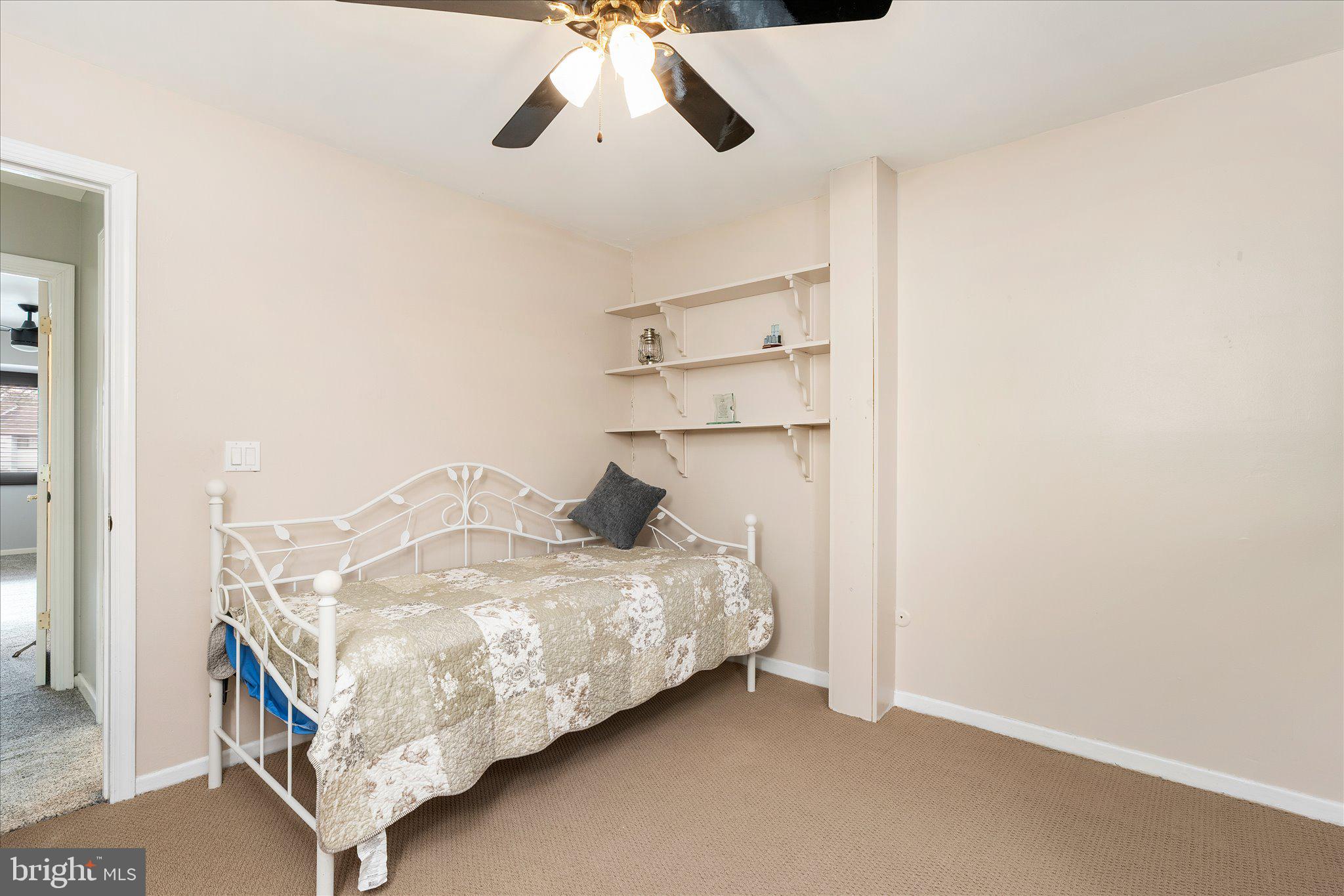 766 Twin Rivers Drive North East Windsor, NJ 08520 - Photo 21 of 31 a bedroom with a bed and cabinets