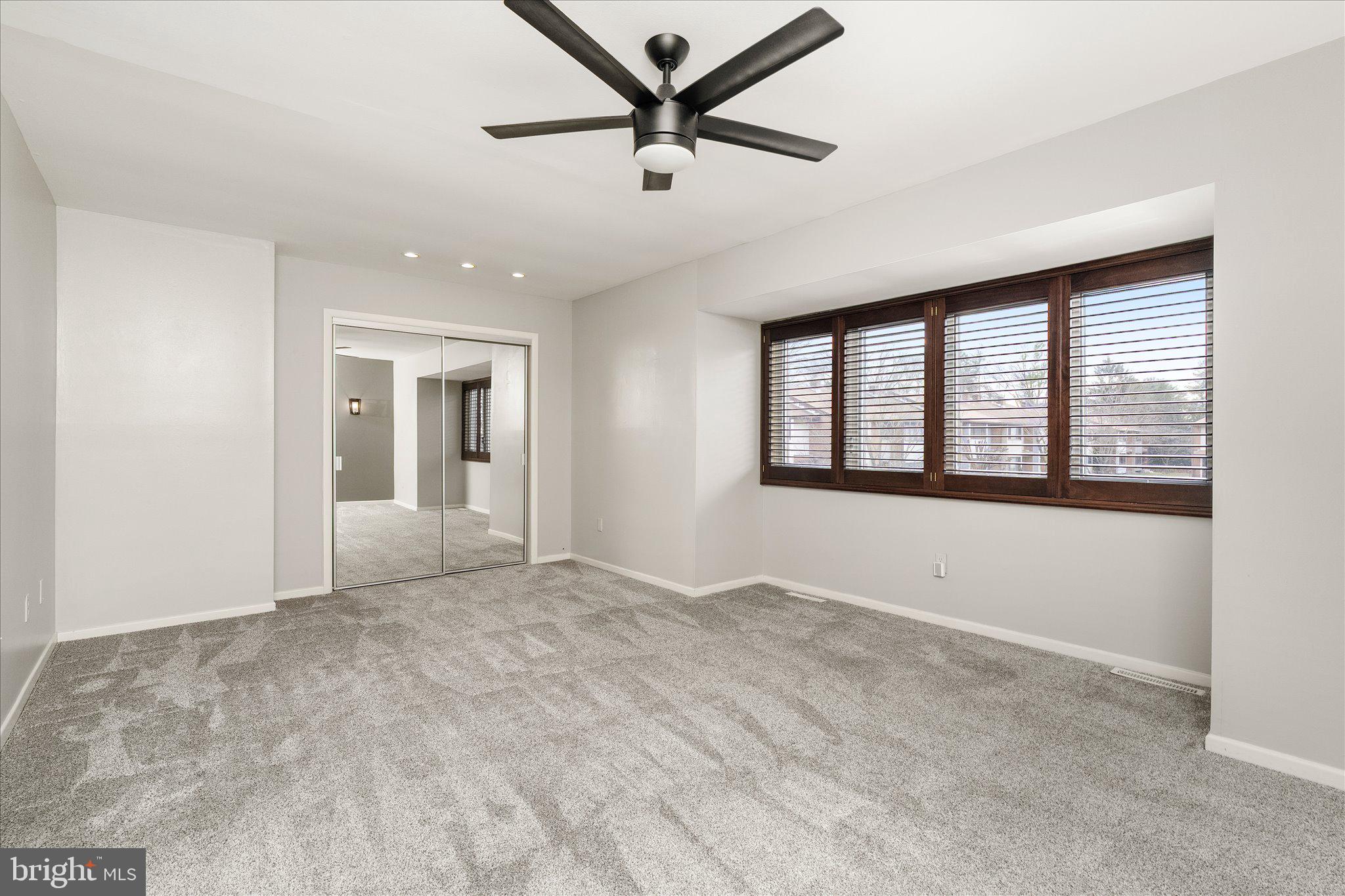 766 Twin Rivers Drive North East Windsor, NJ 08520 - Photo 24 of 31 a view of empty room with a ceiling fan