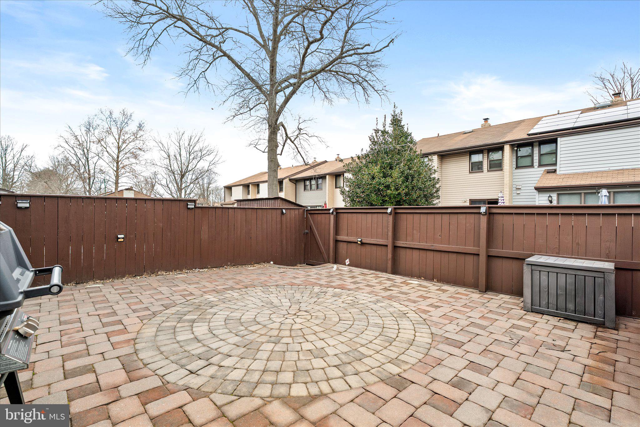 766 Twin Rivers Drive North East Windsor, NJ 08520 - Photo 30 of 31 a backyard of a house with wooden fence