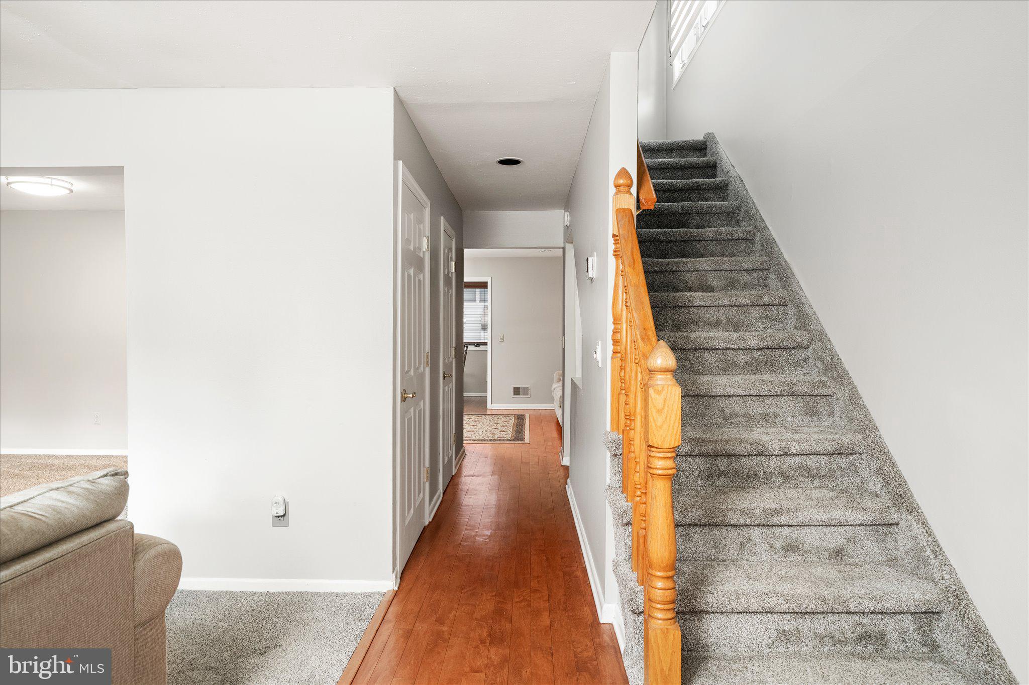 766 Twin Rivers Drive North East Windsor, NJ 08520 - Photo 3 of 31 a view of a hallway with wooden floor and entryway