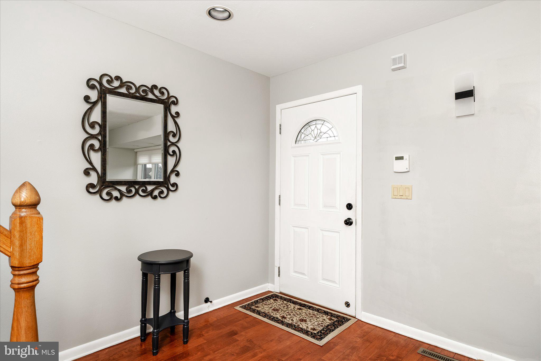 766 Twin Rivers Drive North East Windsor, NJ 08520 - Photo 4 of 31 a view of an entryway with a mirror