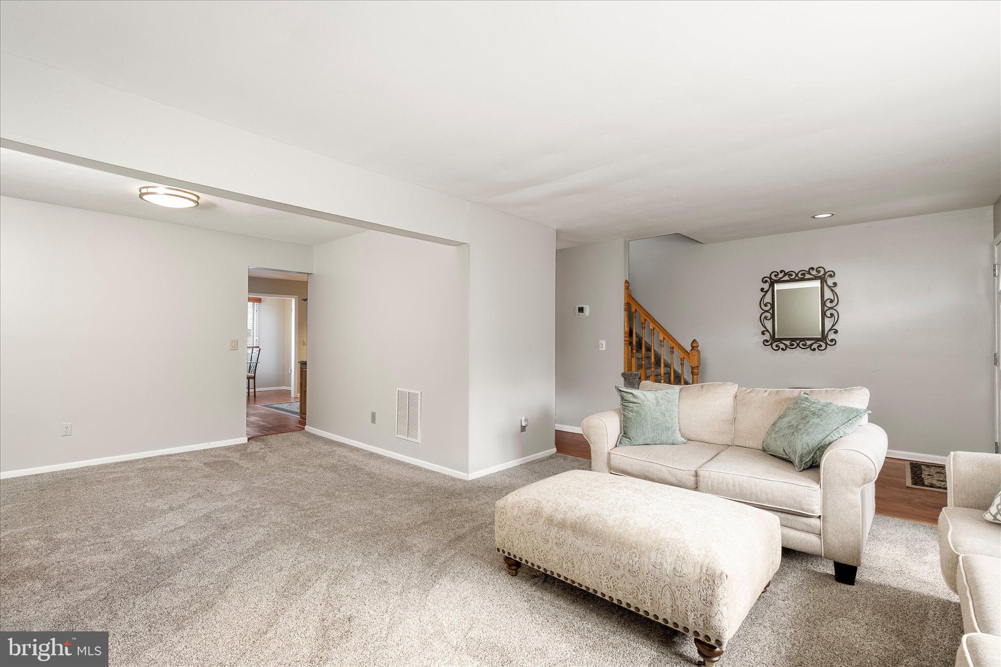 766 Twin Rivers Drive North East Windsor, NJ 08520 - Photo 8 of 31 a living room with furniture and a couch