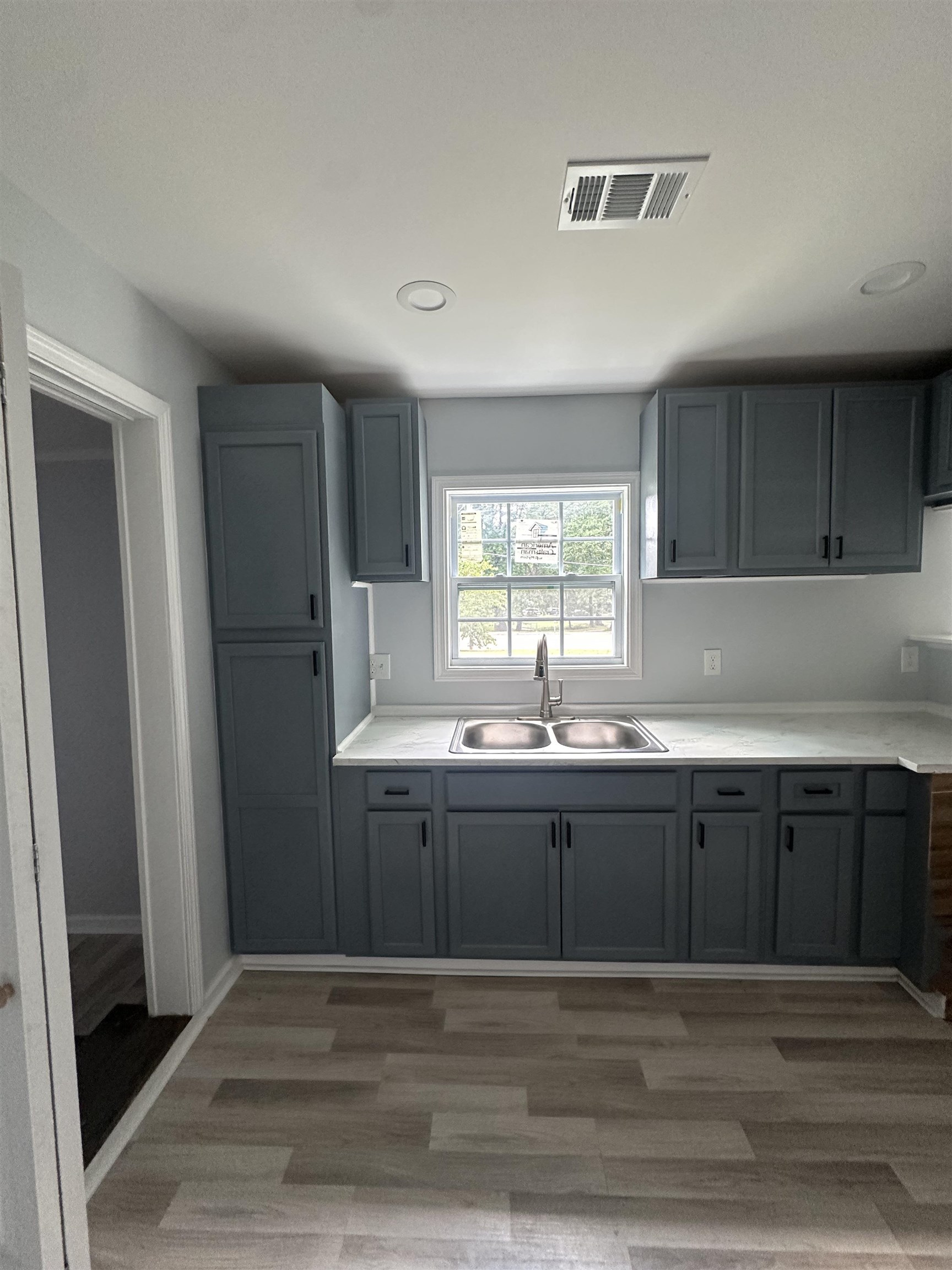 3402 Lakeview Road Memphis, TN 38116 - Photo 21 of 30 Kitchen featuring gray cabinetry, recessed lighting, light wood-style floors, and light countertops