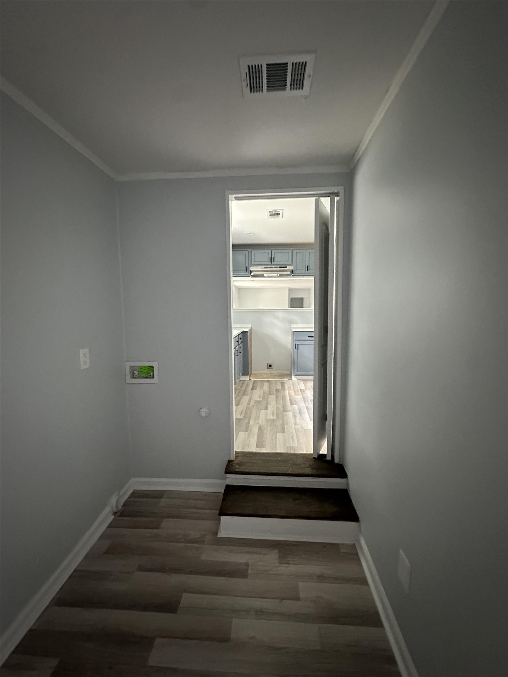 3402 Lakeview Road Memphis, TN 38116 - Photo 22 of 30 Hallway featuring wood finished floors and ornamental molding