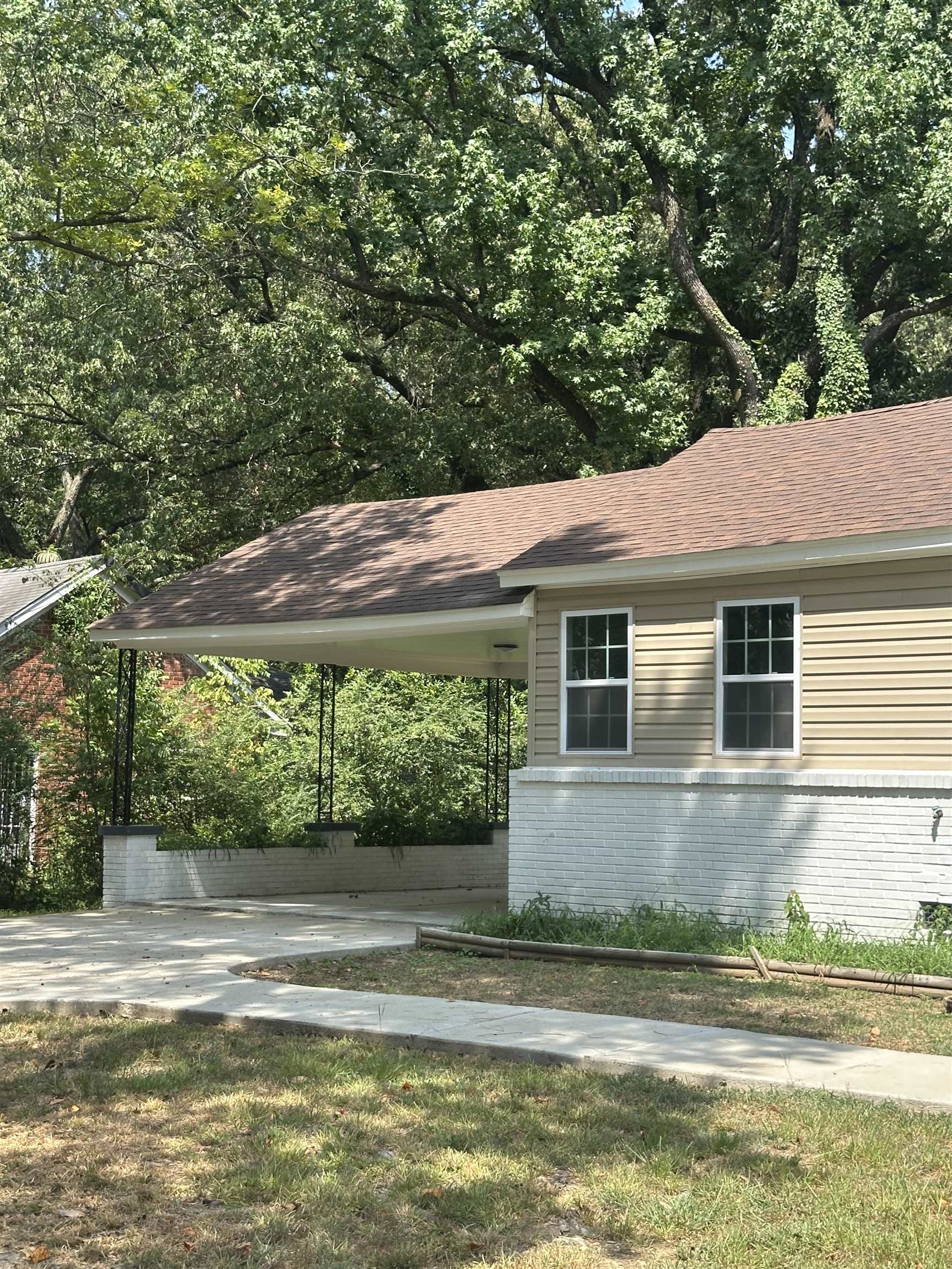 3402 Lakeview Road Memphis, TN 38116 - Photo 28 of 30 View of side of property featuring brick siding and roof with shingles
