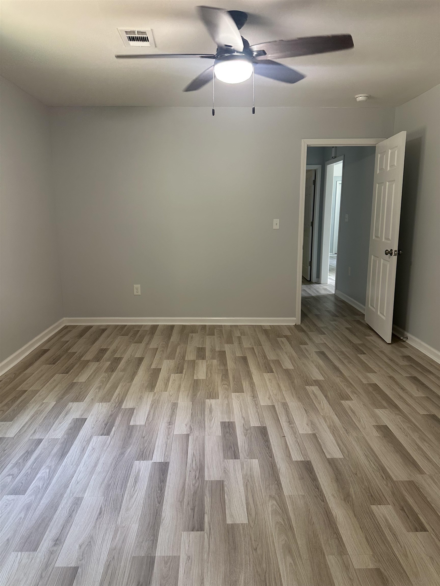 3402 Lakeview Road Memphis, TN 38116 - Photo 9 of 30 Empty room with wood finished floors and a ceiling fan