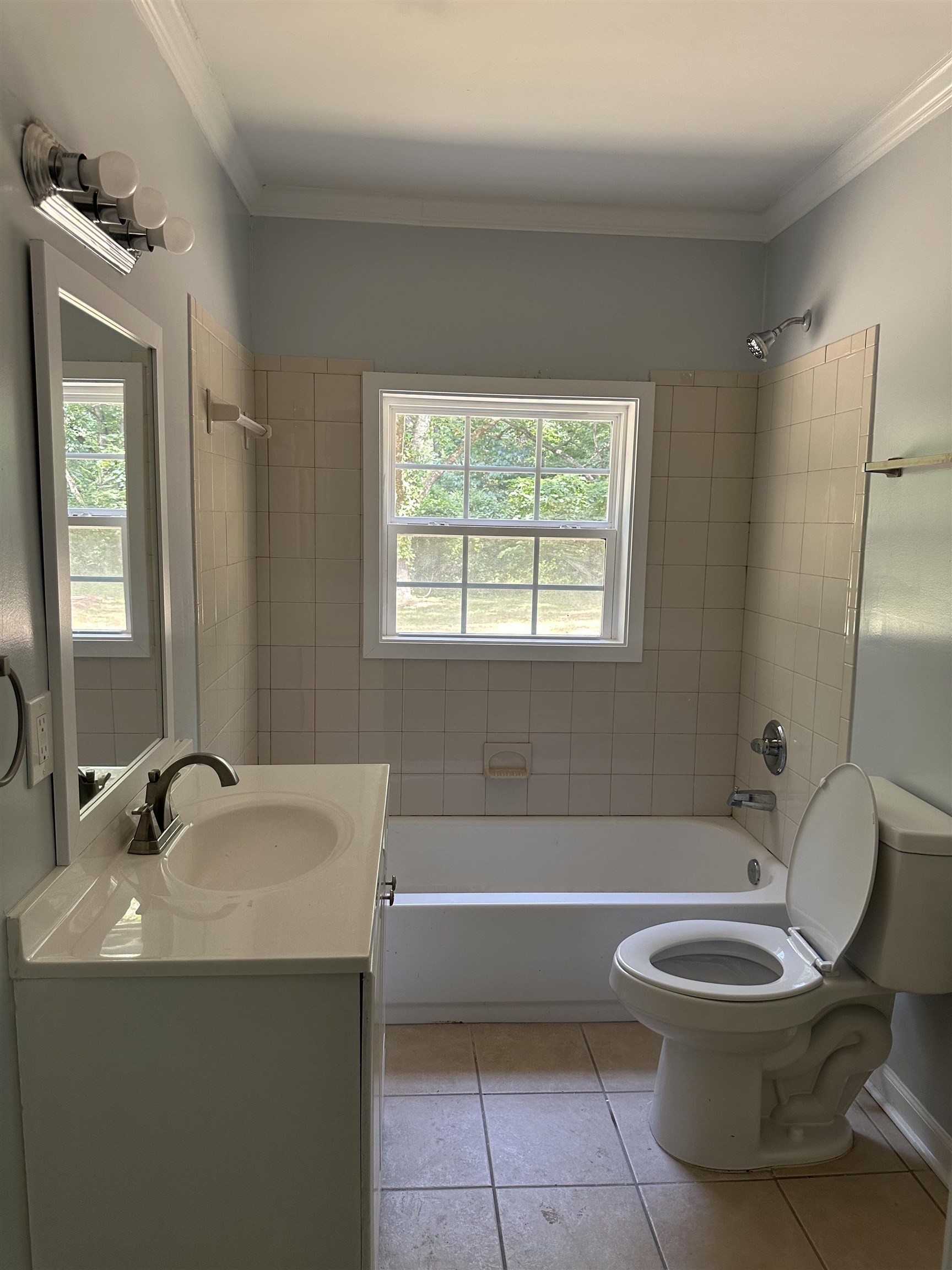 3402 Lakeview Road Memphis, TN 38116 - Photo 10 of 30 Full bath featuring vanity, tile patterned flooring, shower / tub combination, and crown molding