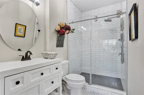 a bathroom with a toilet and a shower