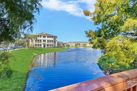 an aerial view of a house with a lake view